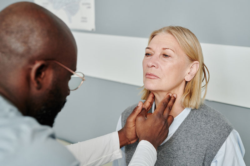 mature blond female patient having checkup