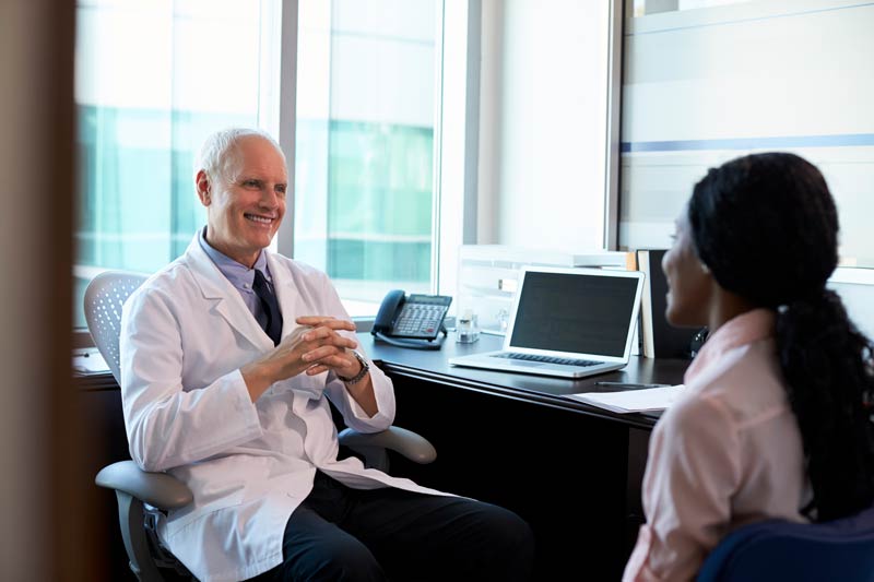 Doctor in consult with woman about surgery